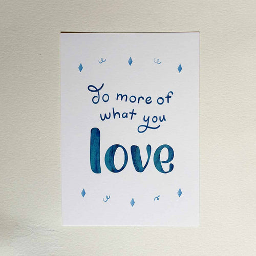 Art Print with the saying Do More of What you Love on a white wall