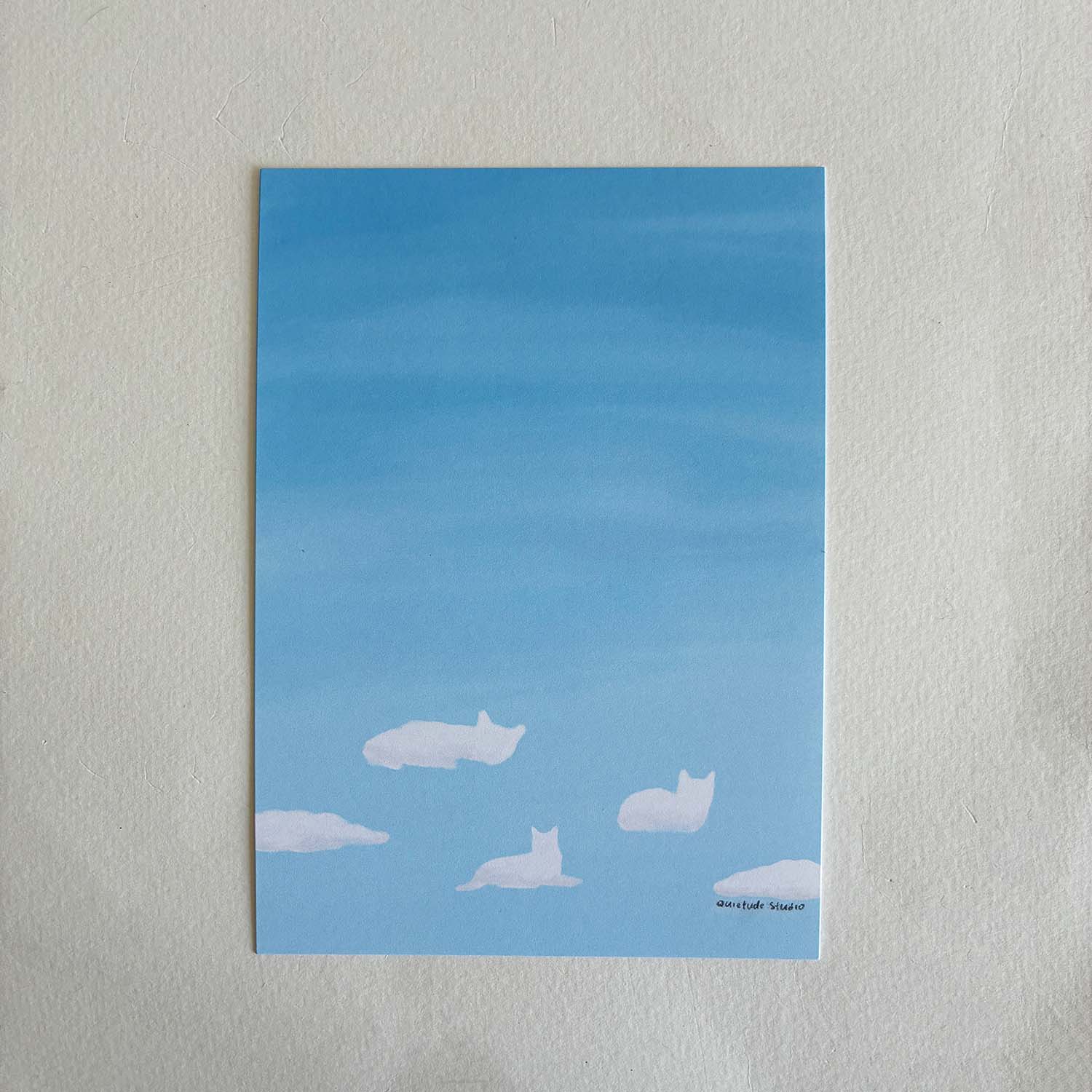 art print with white cat cloud-like shapes on a light blue watercolor background against a white background