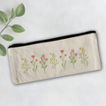 Pencil case with floral designs on a light background