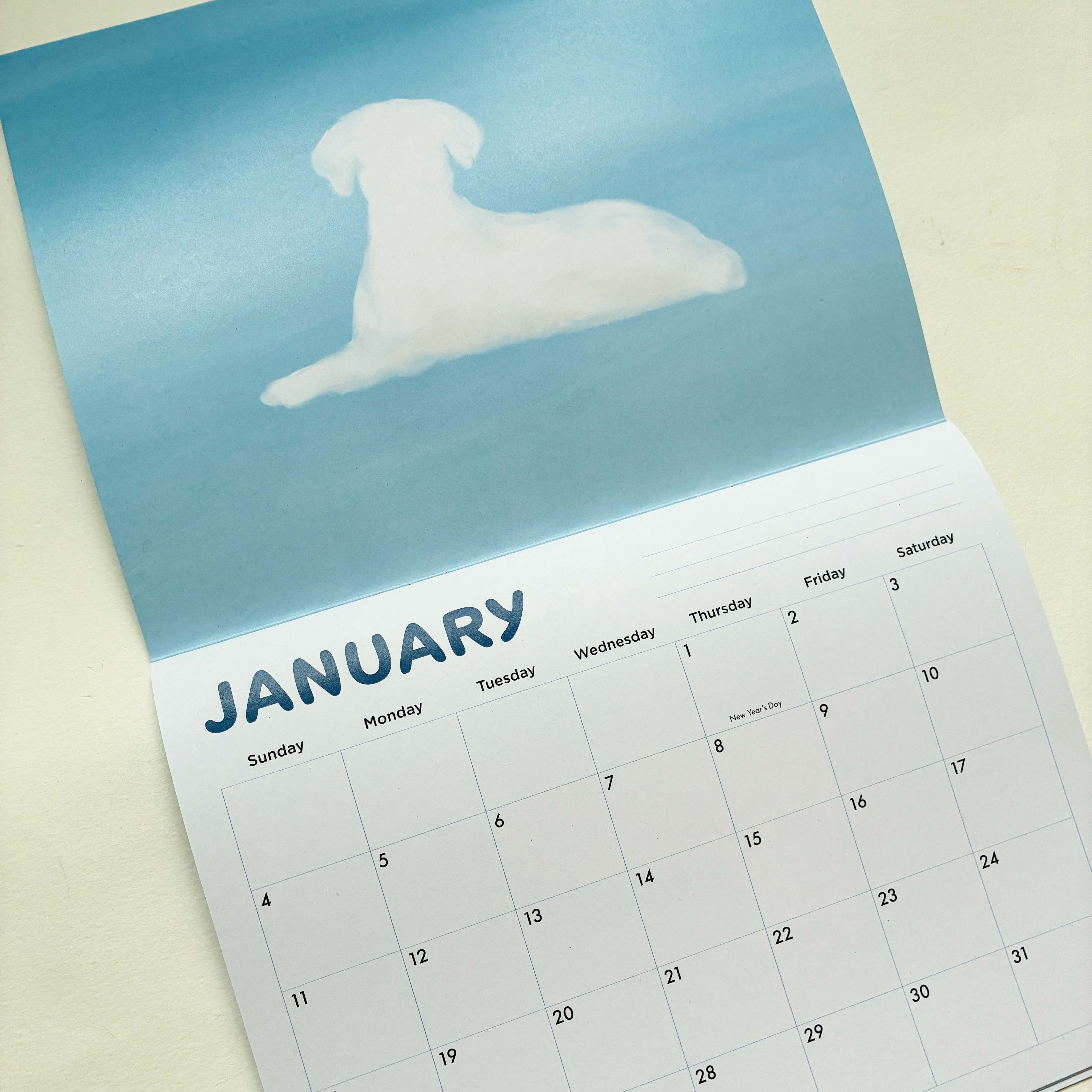 Calendar for January with a dog silhouette on a blue background