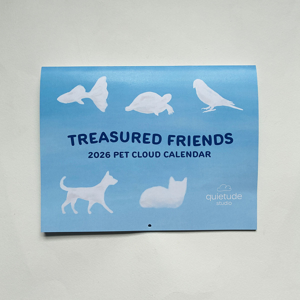 2026 Pet Cloud Calendar titled 'Treasured Friends' with animal silhouettes on a sky background.